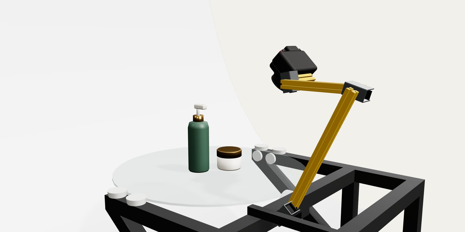 Kolovue shooting a pump bottle and a cream jar, with the arm tilting the camera towards the platform